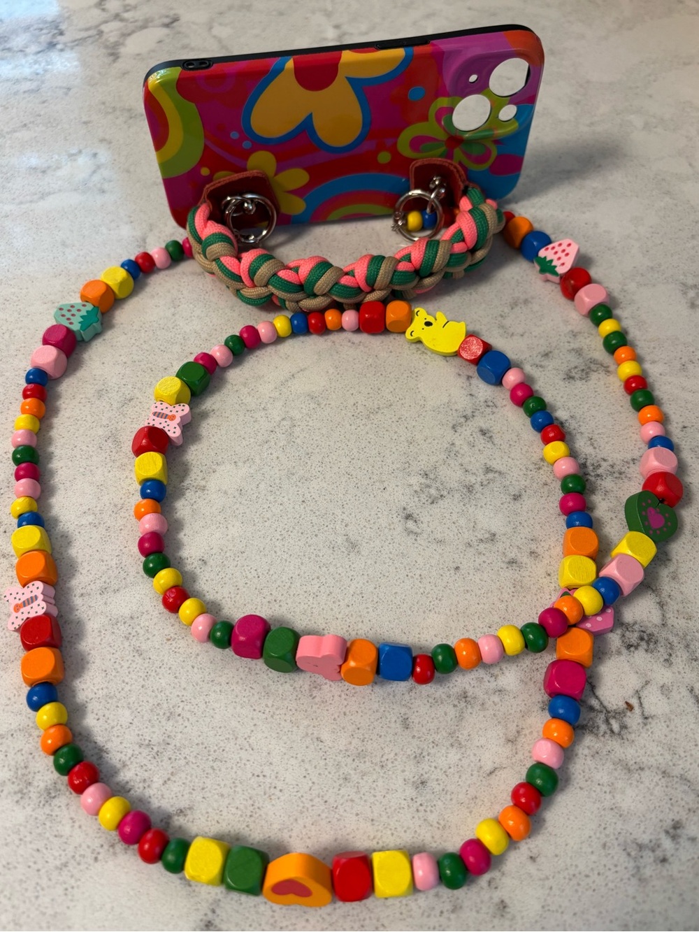 iPhone 15 case with handle and beaded strap